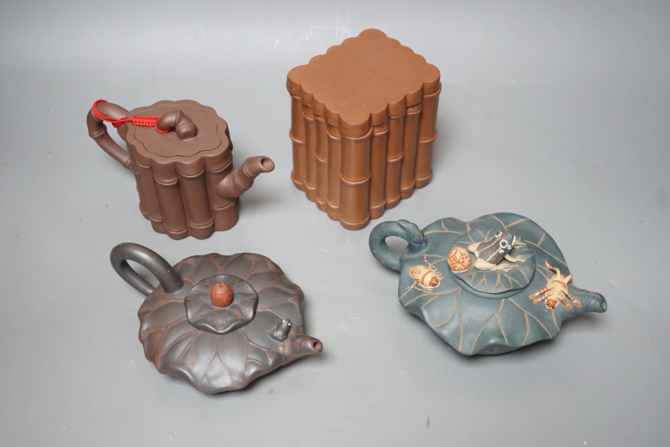 Three Chinese Yixing teapots and a tea caddy